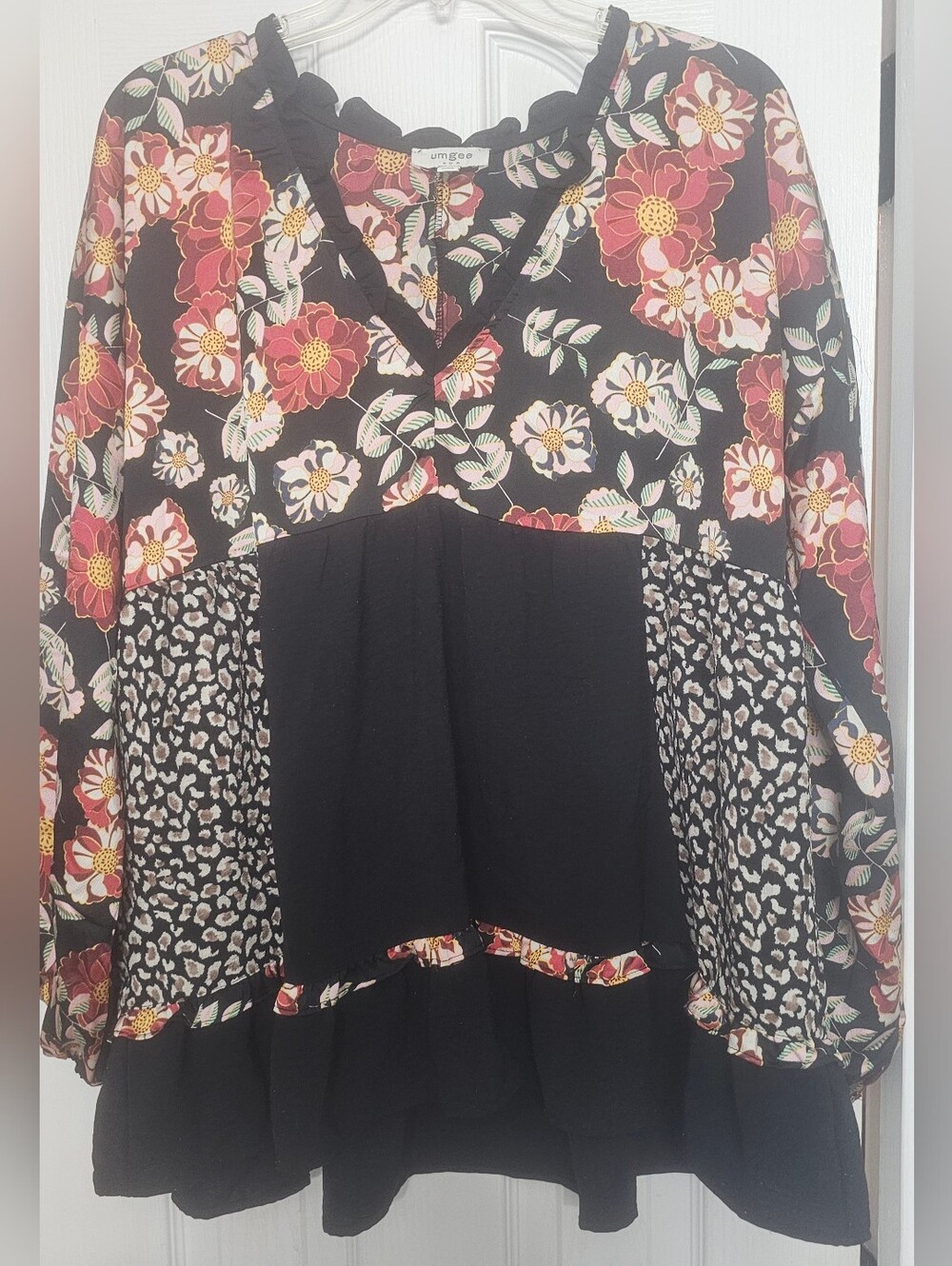 Umgee babydoll blouse features a bold, mixed design combining bohemian andanimal - Picture 2 of 10